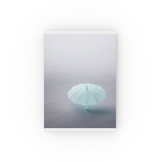 A5 hardcover journal with minimalist greyscale cover and blue umbrella illustration