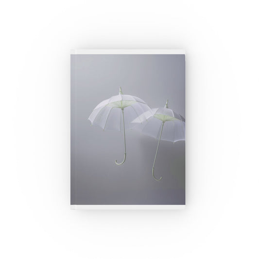 A5 hardcover journal with greyscale cover and two white floating umbrellas illustration