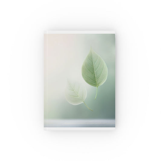 A5 hardcover journal with pale green and white cover and two floating leaves illustration