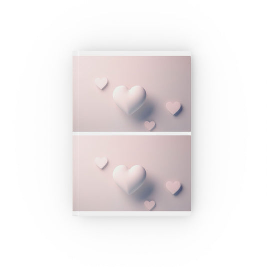 A5 hardcover journal with pink and white cover and surrealist hearts illustration