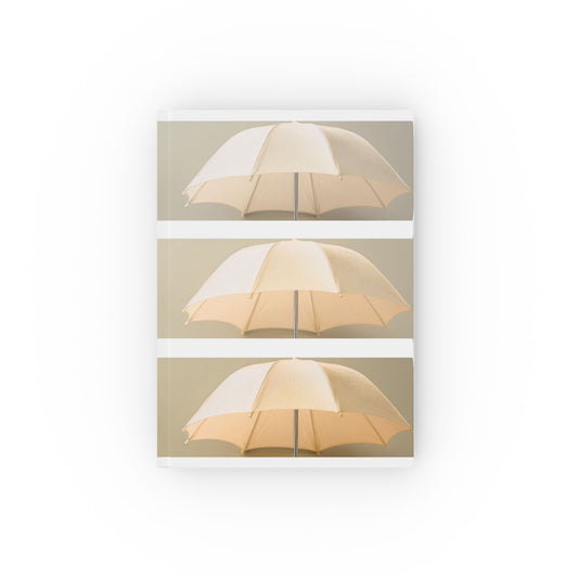 A5 hardcover journal with yellow and white cover and repeated umbrella illustration