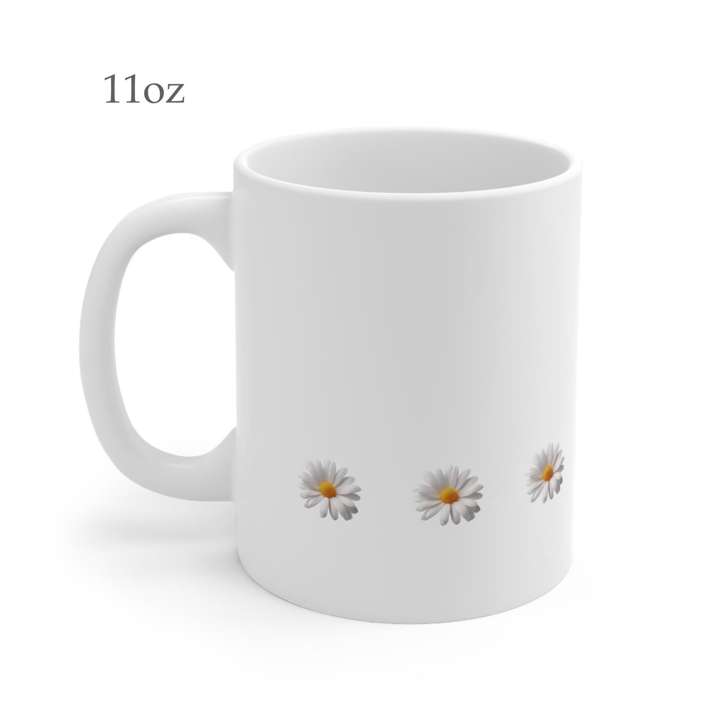 Left side view of white ceramic daisy mug, 11oz size, showing handle