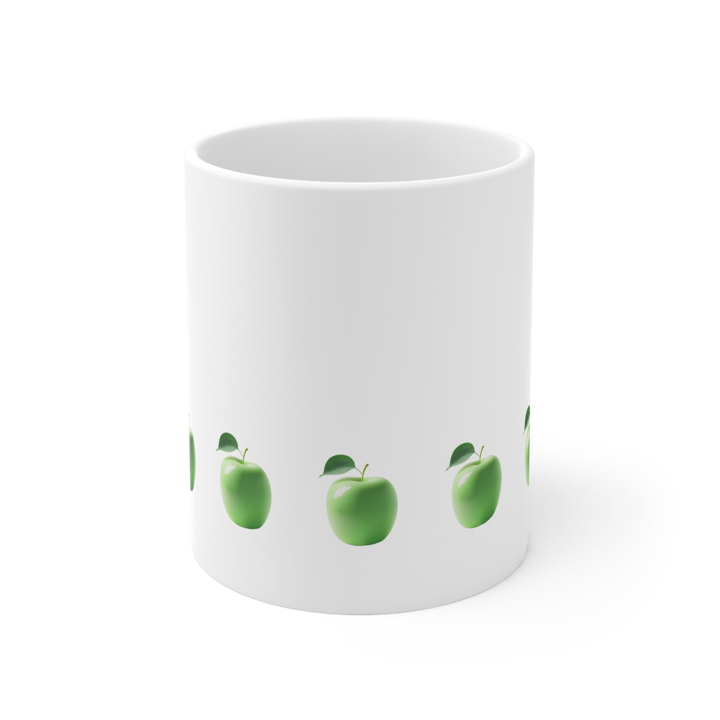 Front view of white ceramic mug with green apple design, 11oz size
