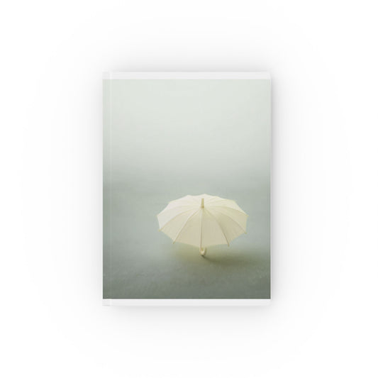 A5 hardcover journal with minimalist greyscale cover and yellow umbrella illustration