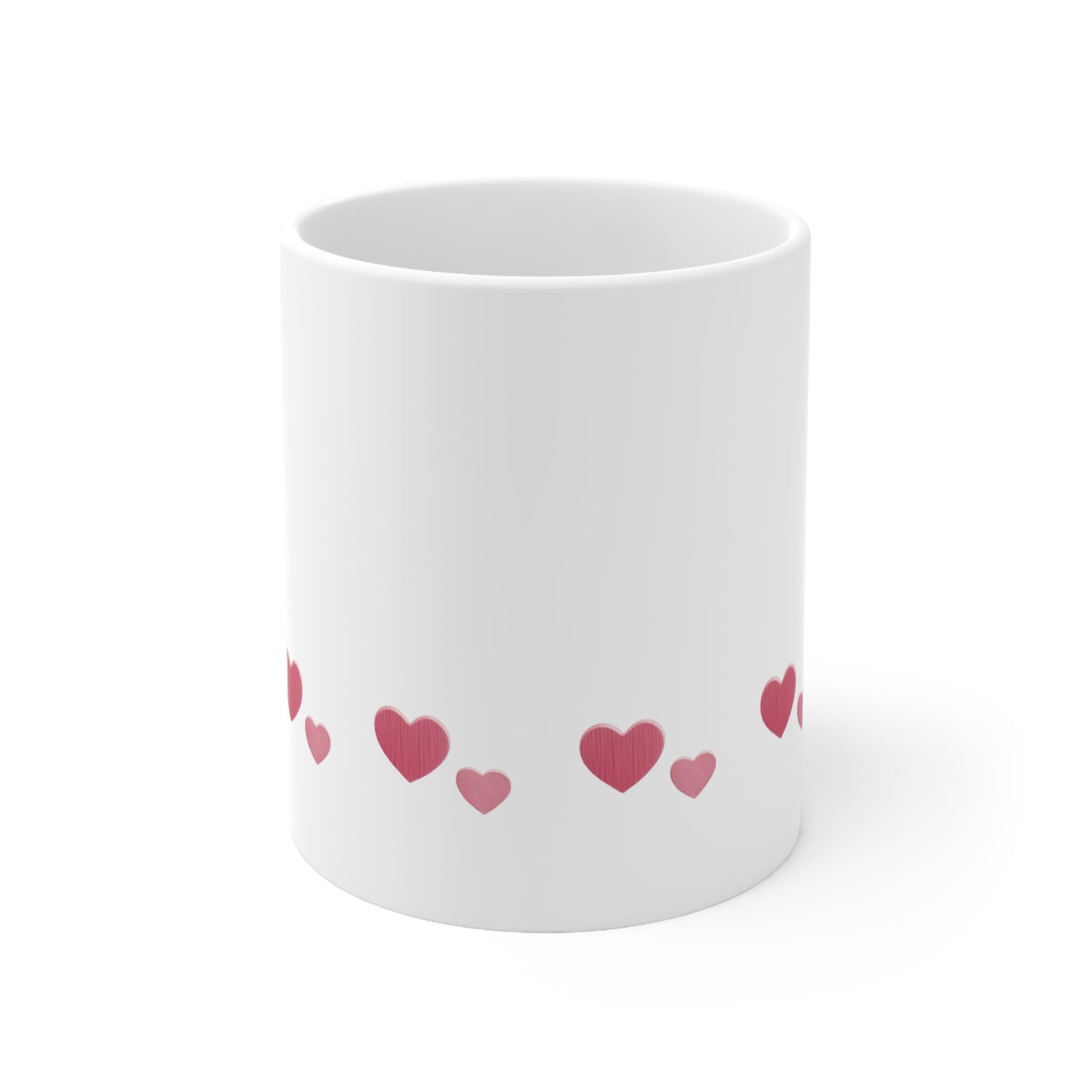 Front view of white ceramic mug with red heart design, 11oz size