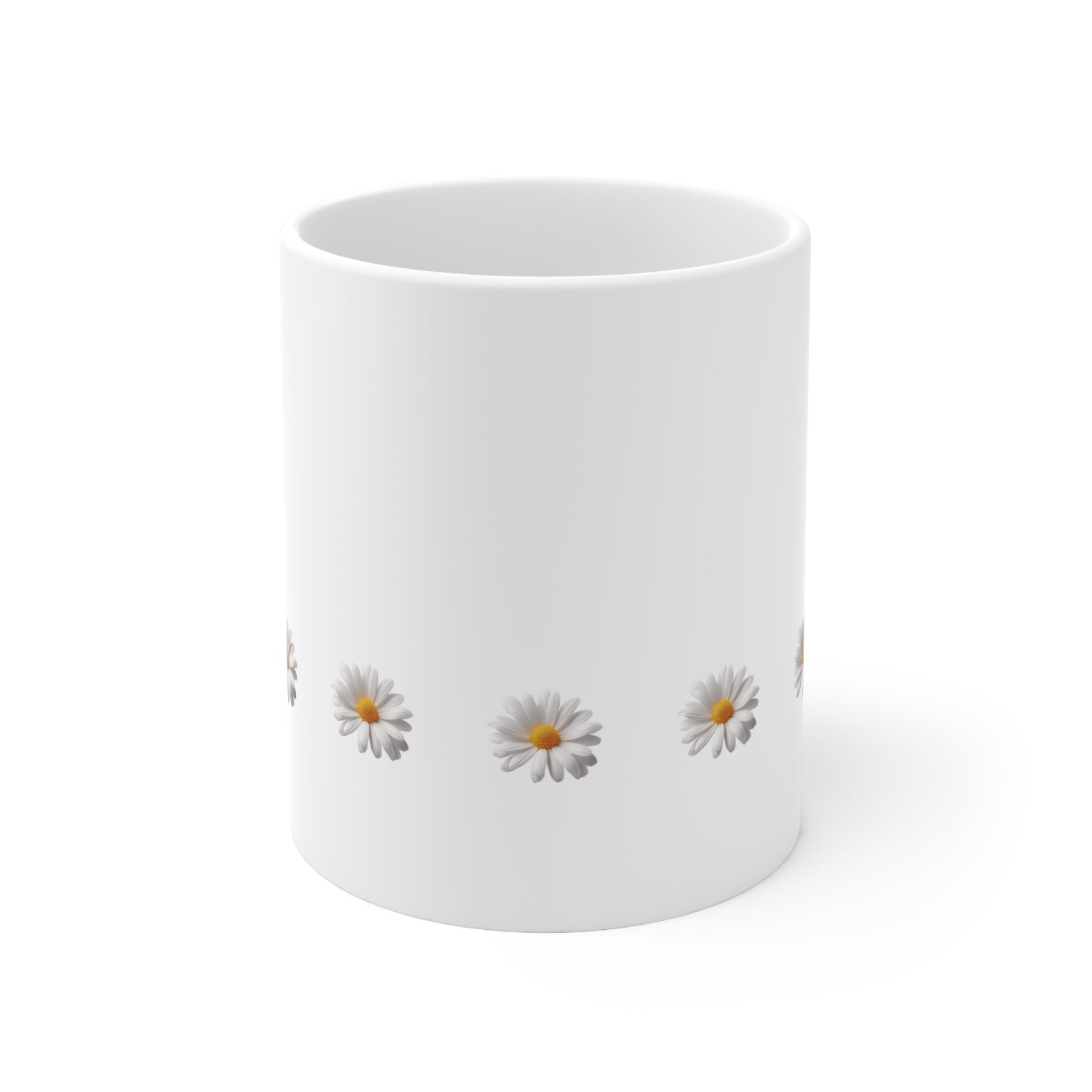 Front view of white ceramic mug with daisy design, 11oz size