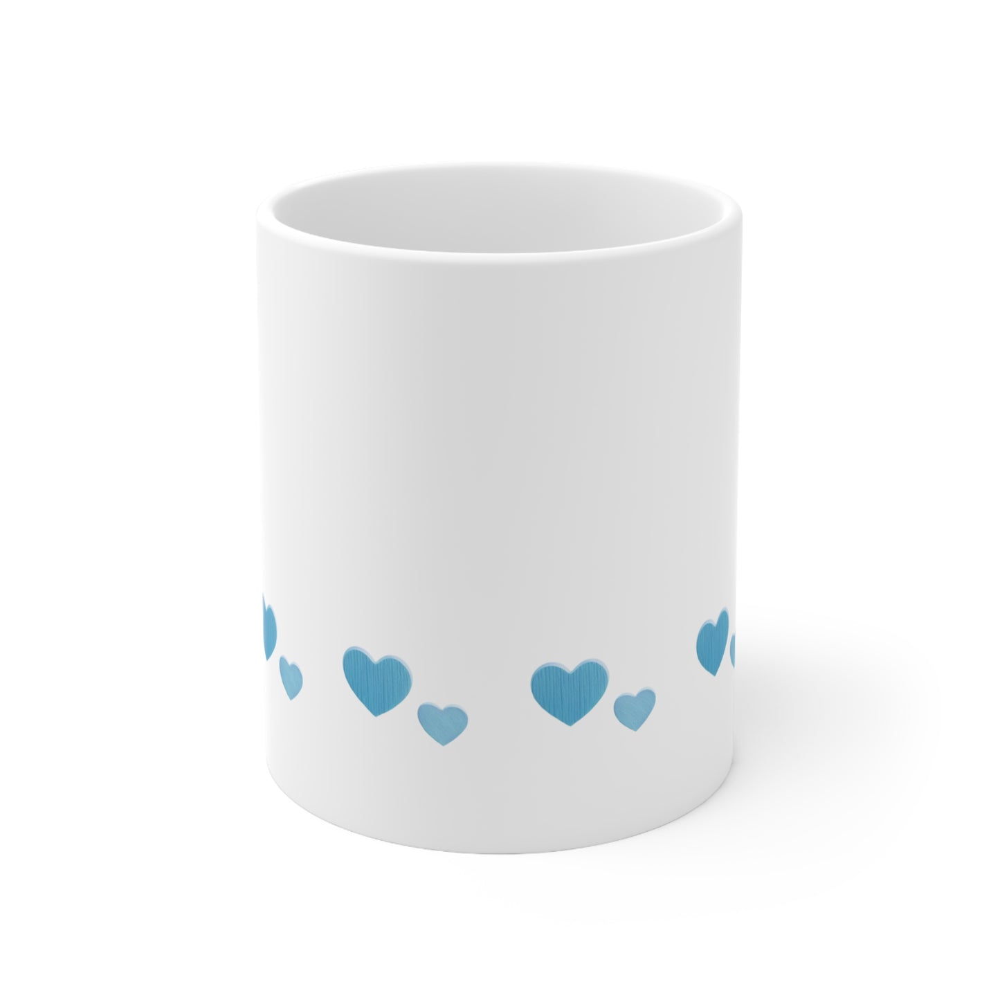 Front view of white ceramic mug with blue heart design, 11oz size