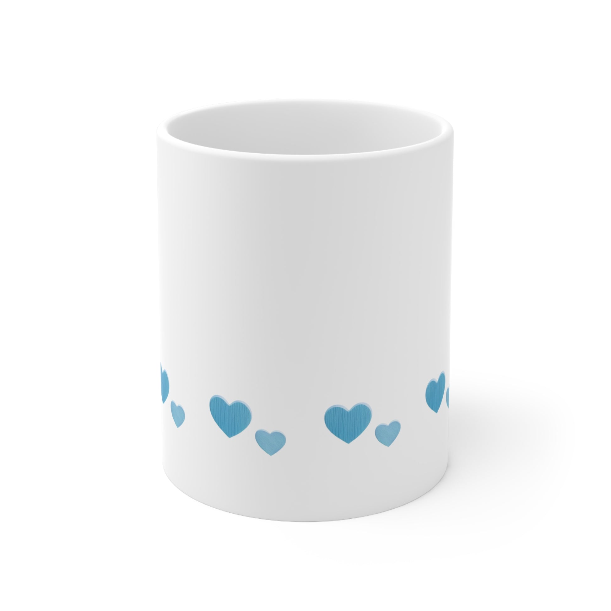 Front view of white ceramic mug with blue heart design, 11oz size